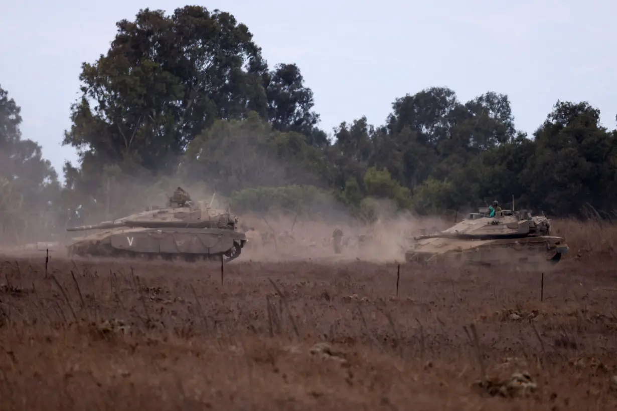 Israeli Army tanks are being moved, in the Israeli-occupied Golan Heights