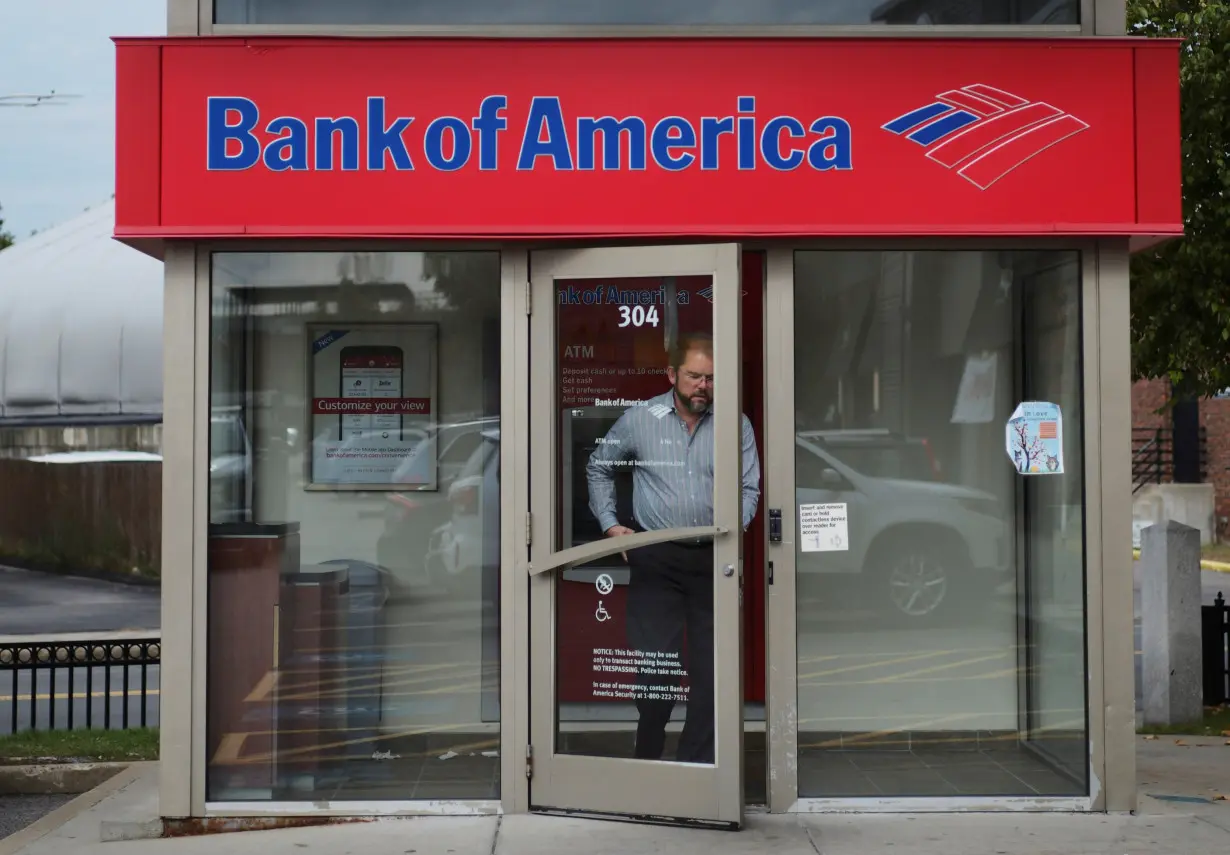 Customer leaves a Bank of America ATM kiosk in Boston