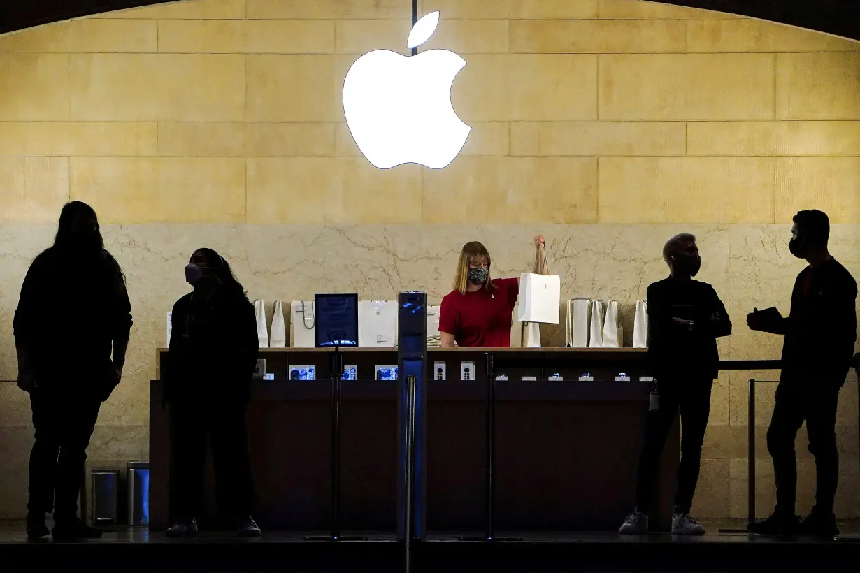 FILE PHOTO: Apple employees work in Apple Store at Grand Central Terminal, New York City