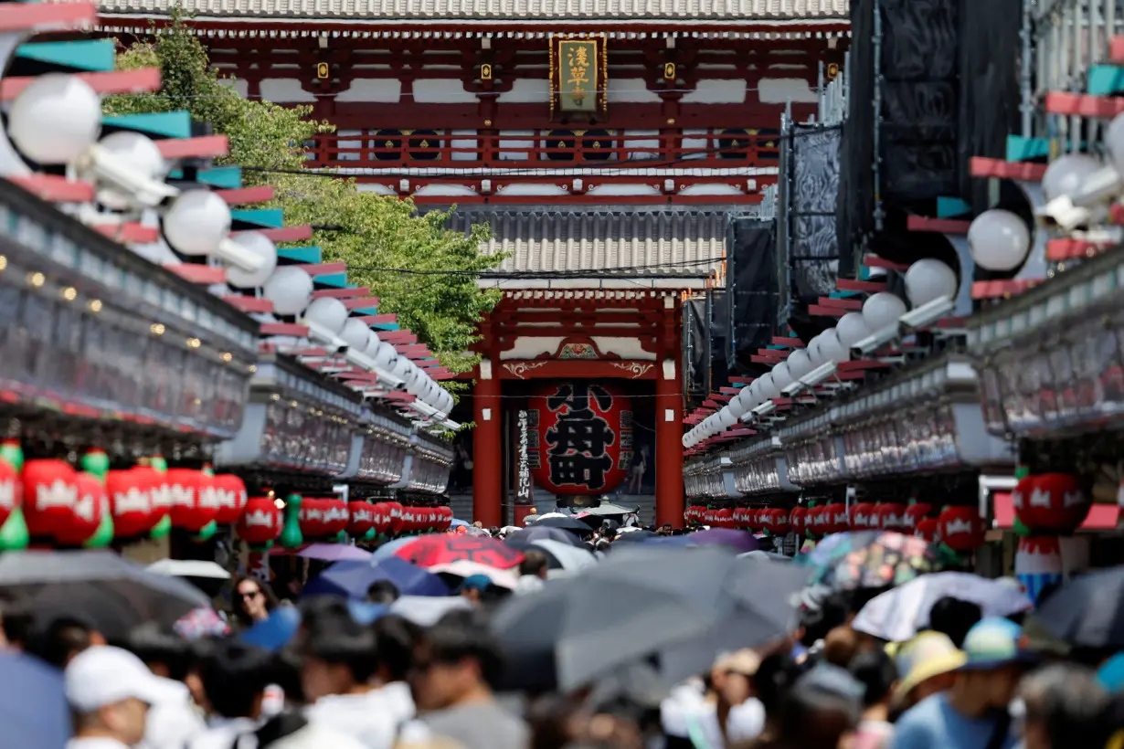 People visit Sensoji temple in Tokyo