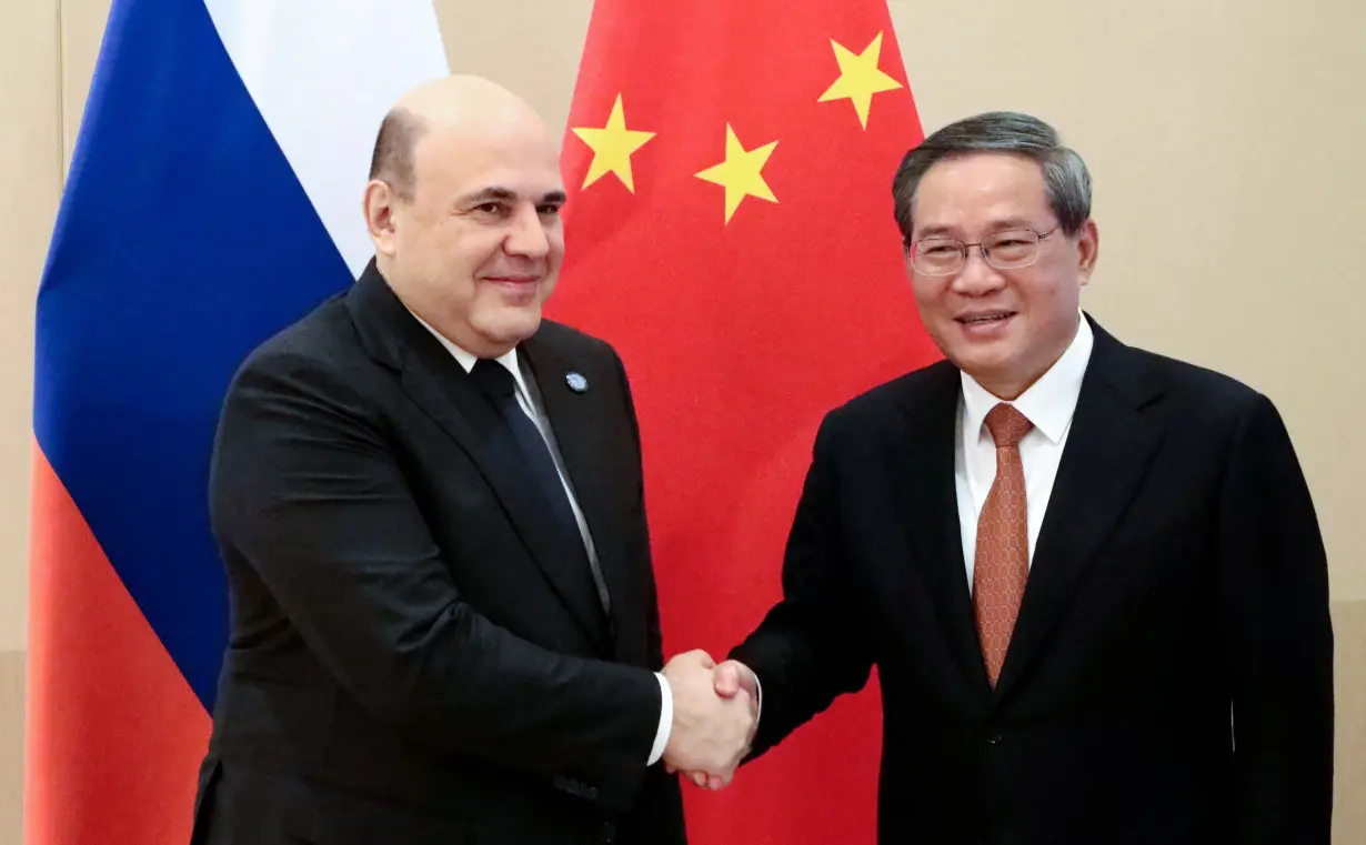 Russian Prime Minister Mikhail Mishustin and Chinese Premier Li Qiang meet in Islamabad