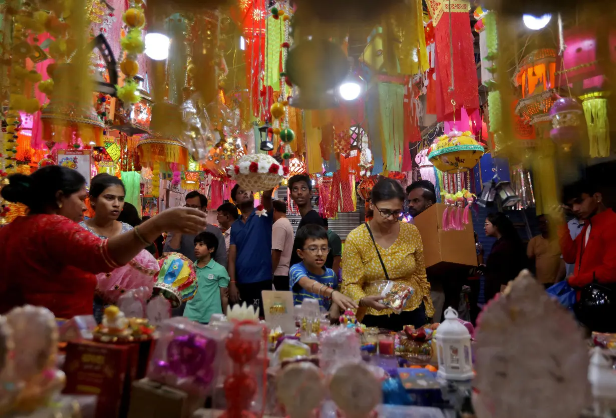 FILE PHOTO: People shop for lanterns at a market ahead of the Hindu festival of Diwali in Mumbai