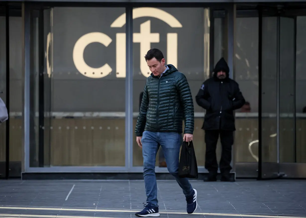 Workers exit the Citi Headquarters in New York