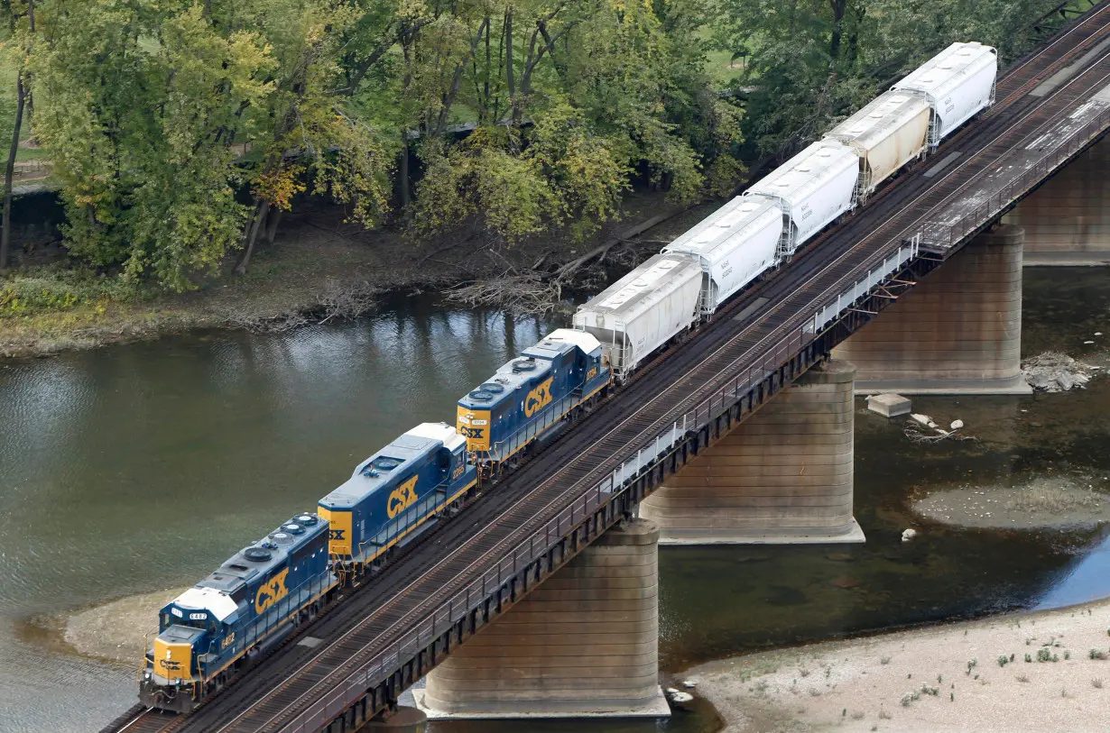 A CSX freight train crosses the Potomac River in Harpers Ferry, West Virginia