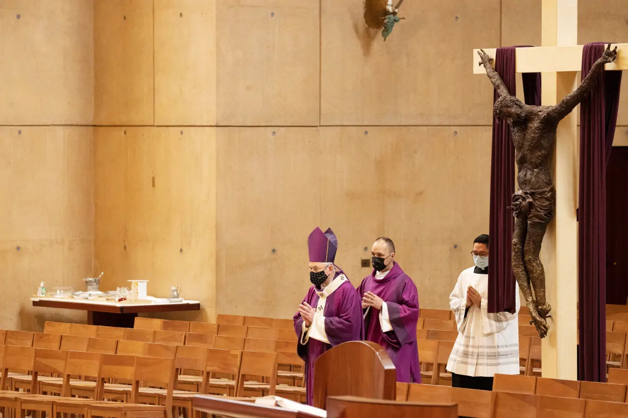 Archbishop Jose H. Gomez enters for Ash Wednesday mass at Cathedral of Our Lady of the Angels during the outbreak of the coronavirus disease (COVID-19), in Los Angeles