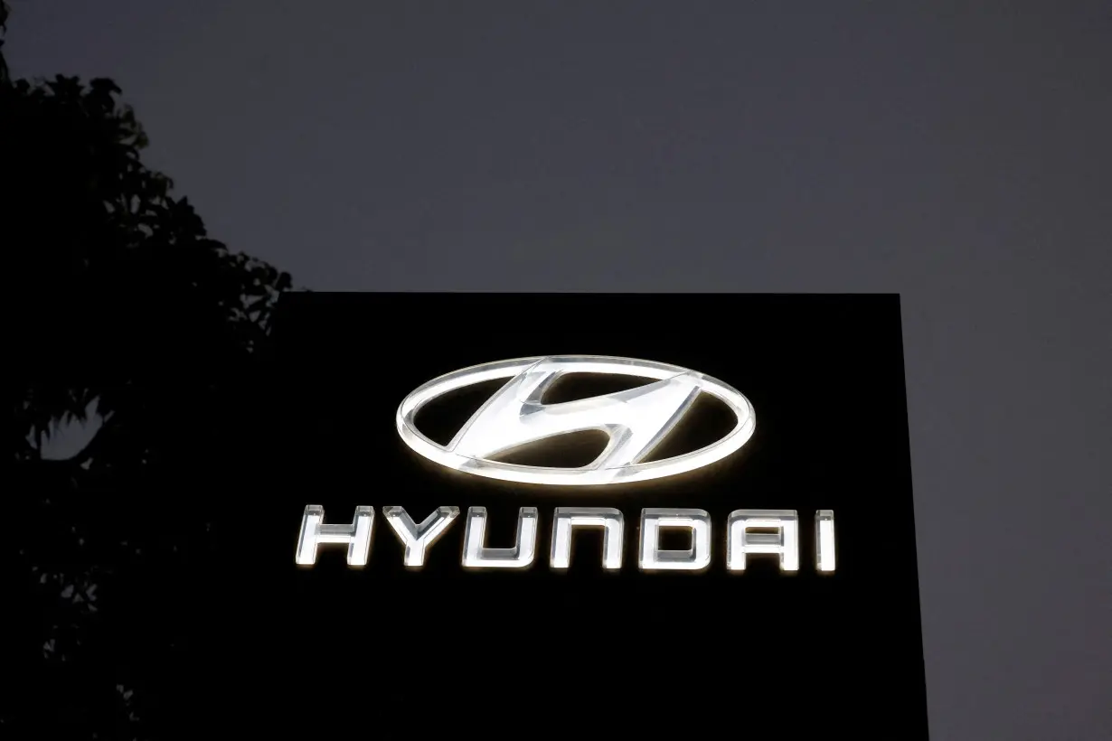 FILE PHOTO: The Logo of Hyundai Motor India Limited is seen outside a car showroom, in Ahmedabad