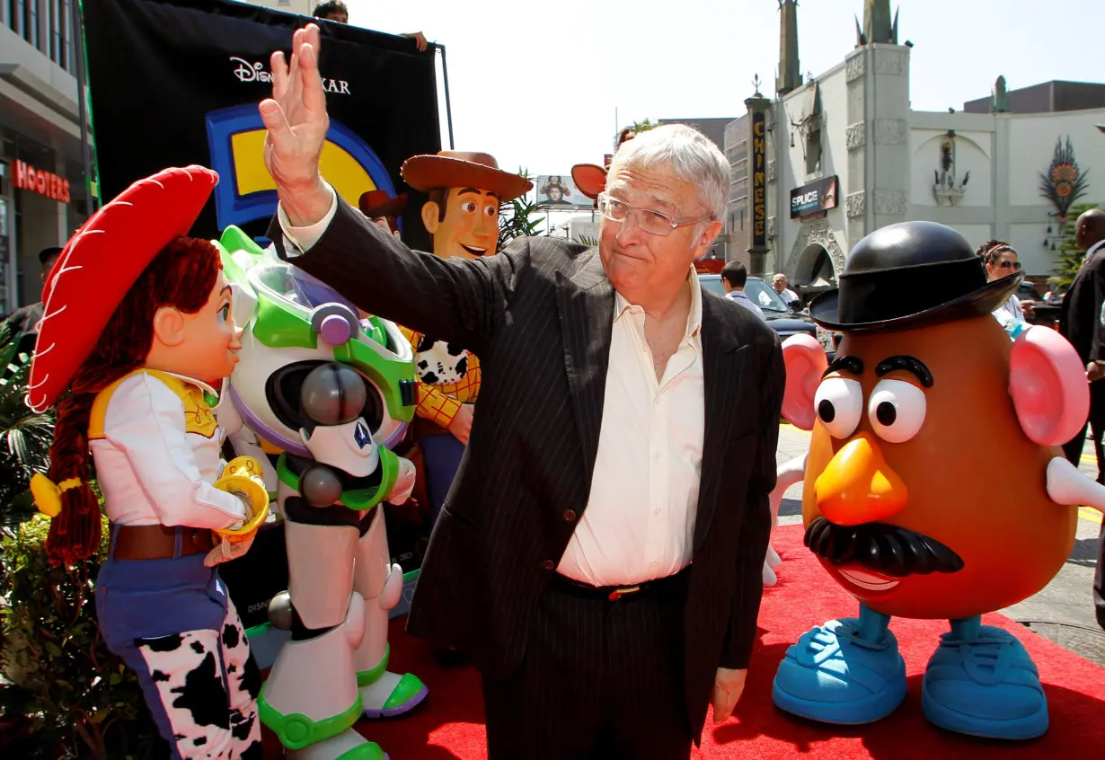 Composer Newman waves as he arrives at world premiere of Disney Pixar's 