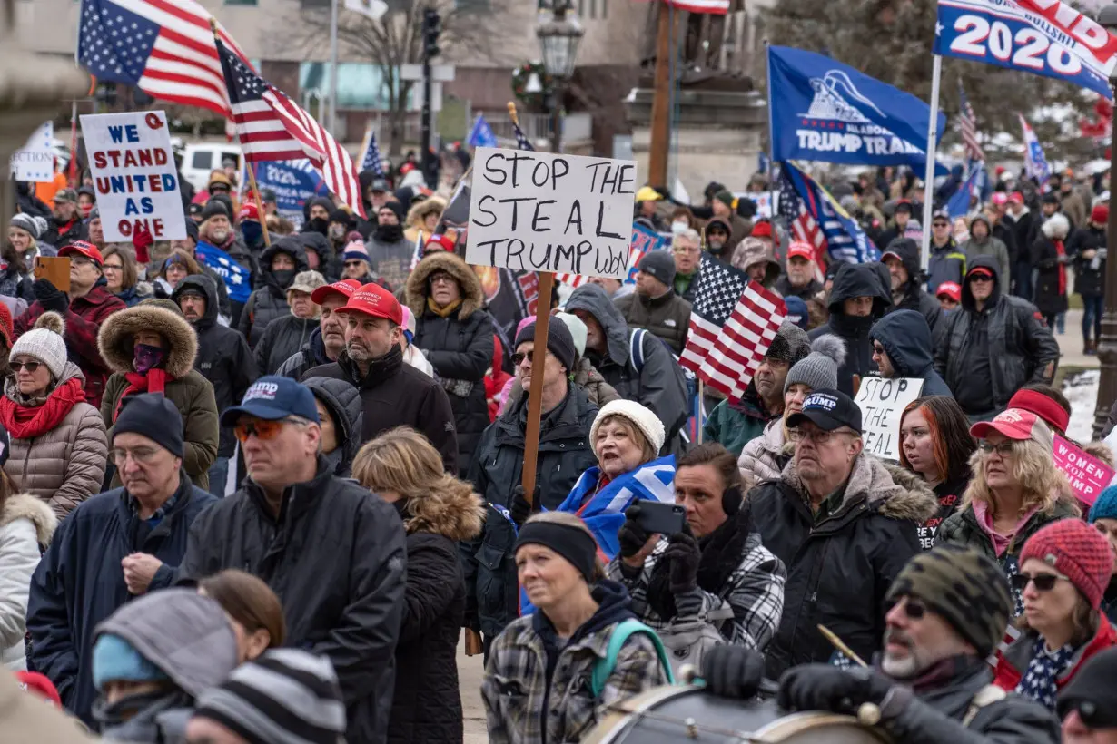 Supporters of then-President Donald Trump gather outside of Michigan's State Capitol building in Lansing on January 6, 2021.