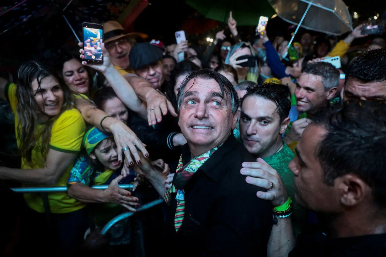 FILE PHOTO: Former Brazilian President Jair Bolsonaro meets with supporters in Porto Alegre