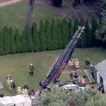 Person rescued after falling 30 feet into covered well, officials say