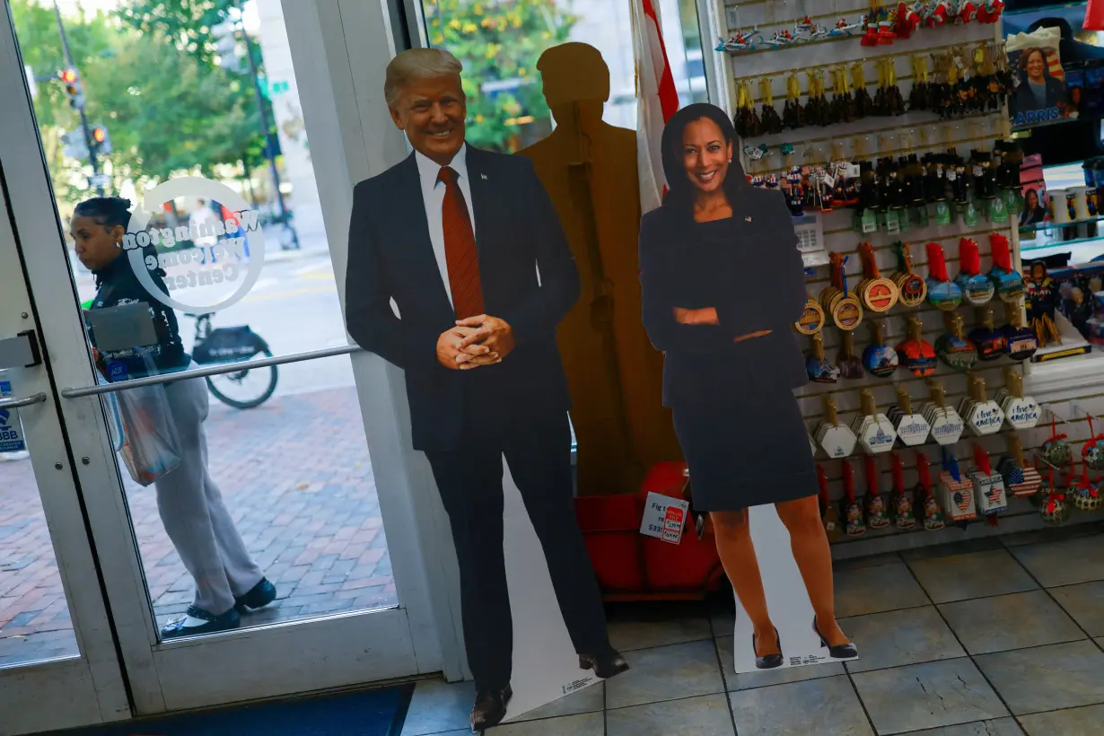 Cutouts of U.S. presidential nominees Trump and Harris are displayed at a souvenir shop, in Washington