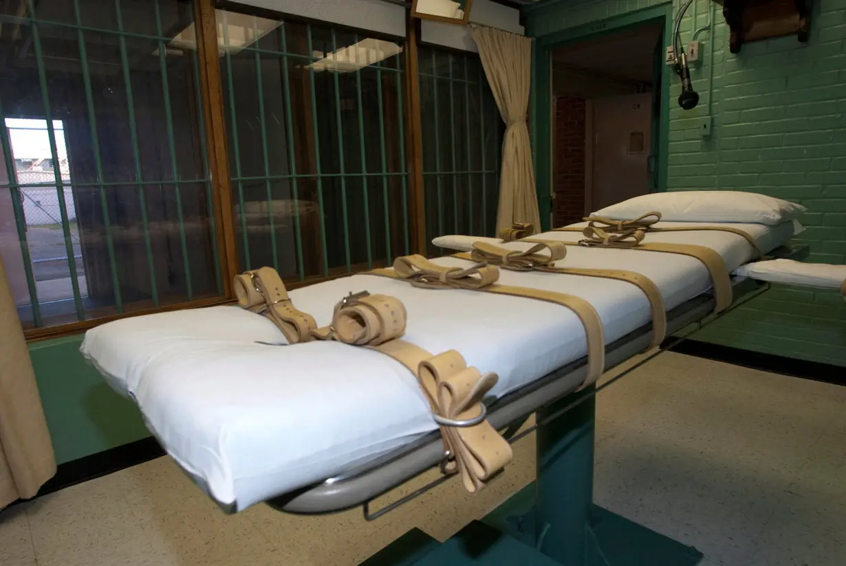 FILE PHOTO: The death chamber and the steel bars of the viewing room at the state penitentiary in Huntsville