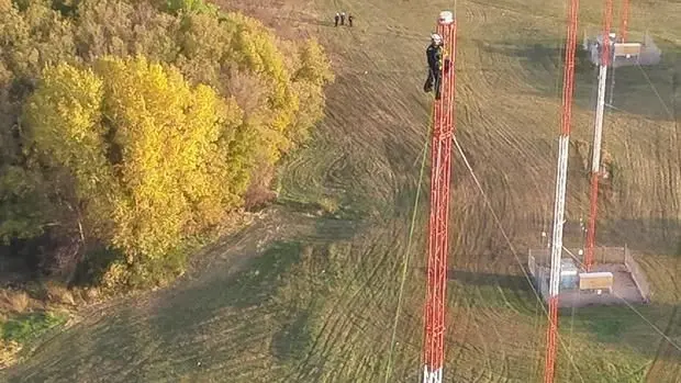 Video shows daring rescue of man who climbed 250 feet up a radio tower