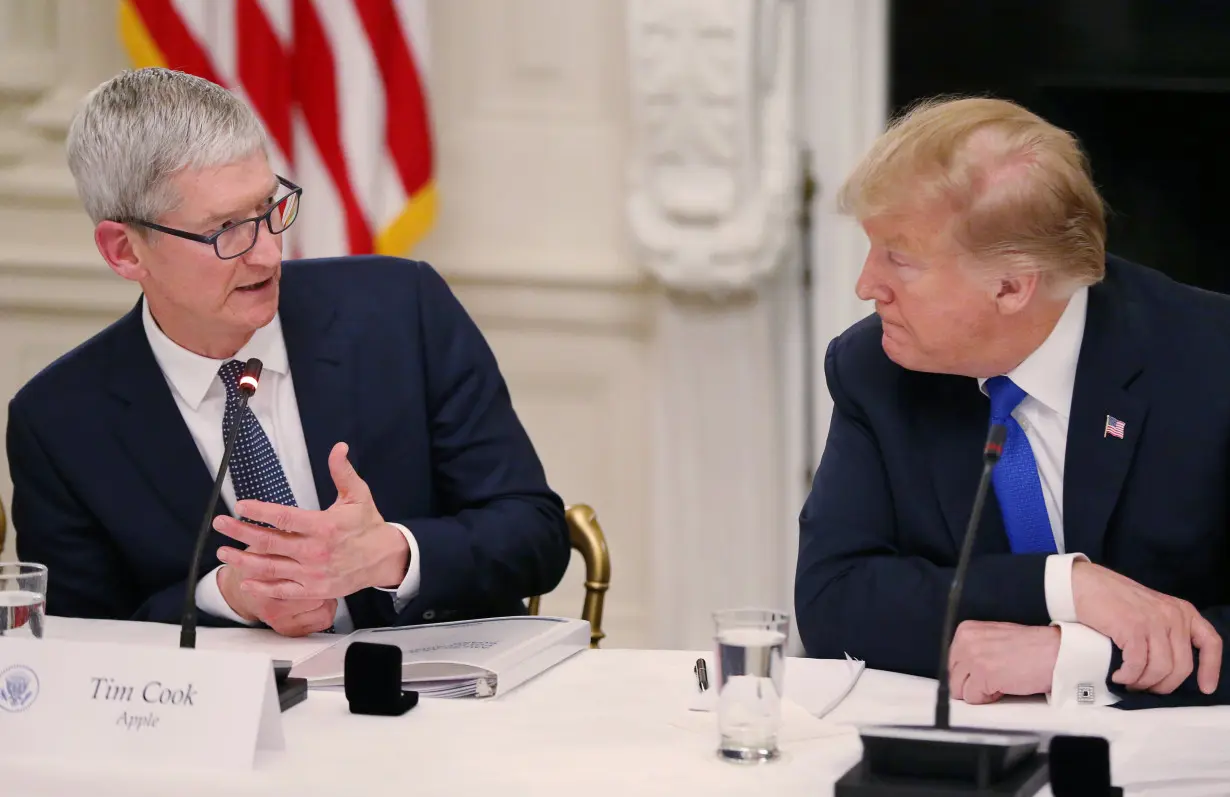 Apple CEO Cook and U.S. President Trump participate in American Workforce Policy Advisory Board meeting at the White House in Washington