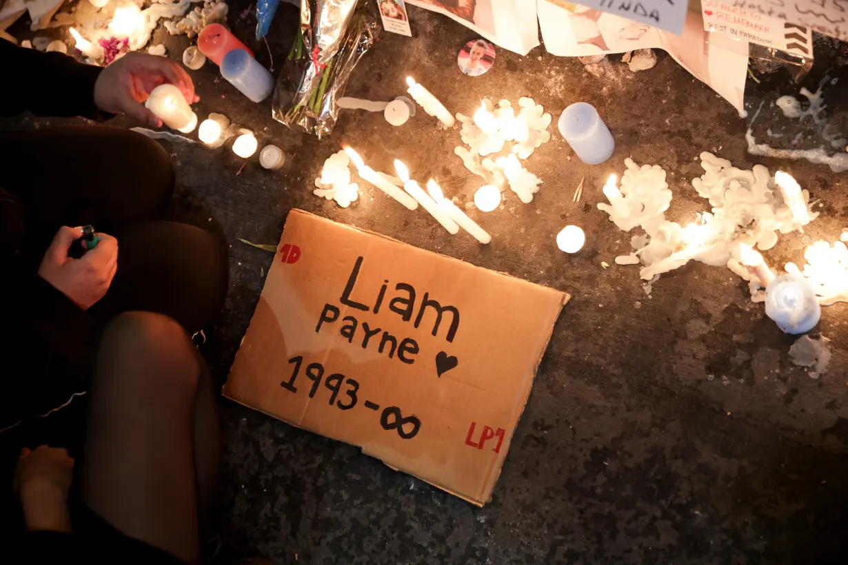 People gather outside the hotel where Liam Payne was found dead, in Buenos Aires