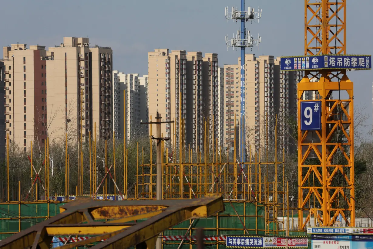 Residential buildings are pictured near a construction site in Beijing