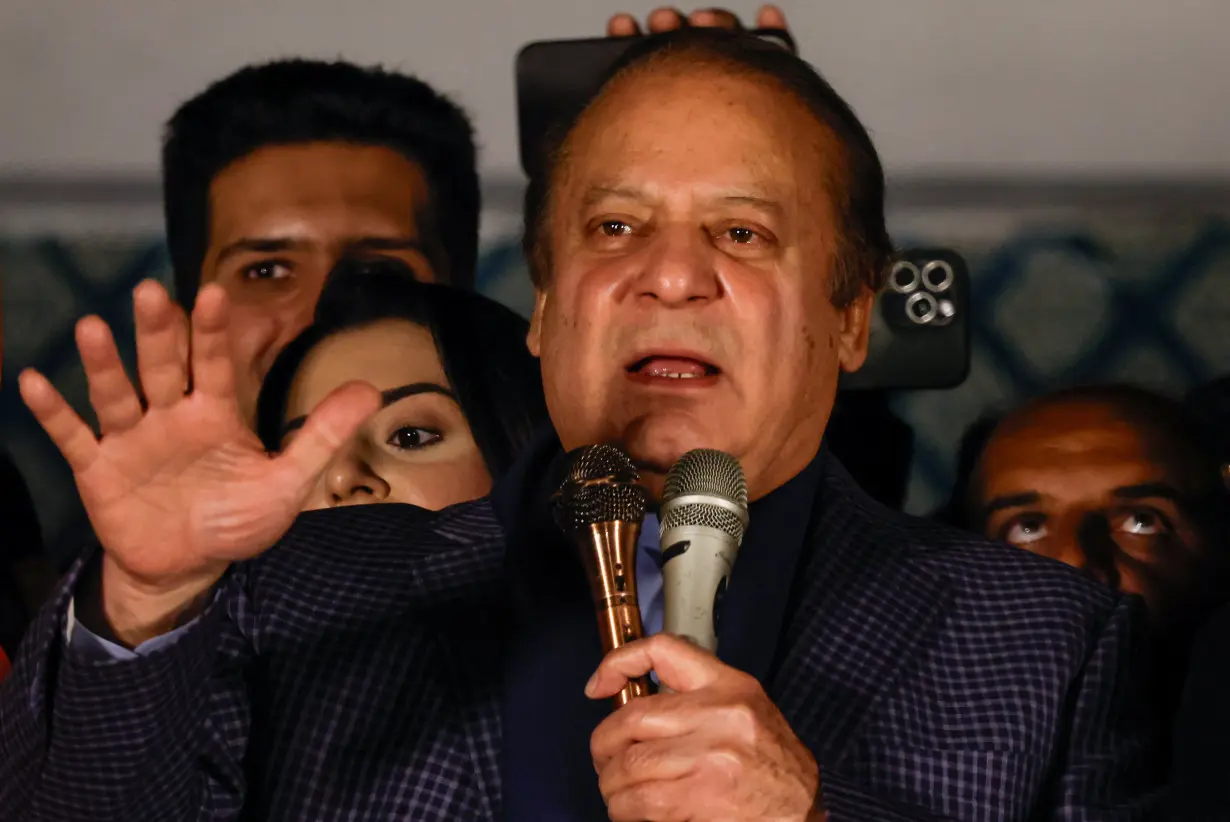 Supporters of Former Prime Minister of Pakistan Nawaz Sharif cheer as they gather at the party office of Pakistan Muslim League (N) at Model Town in Lahore