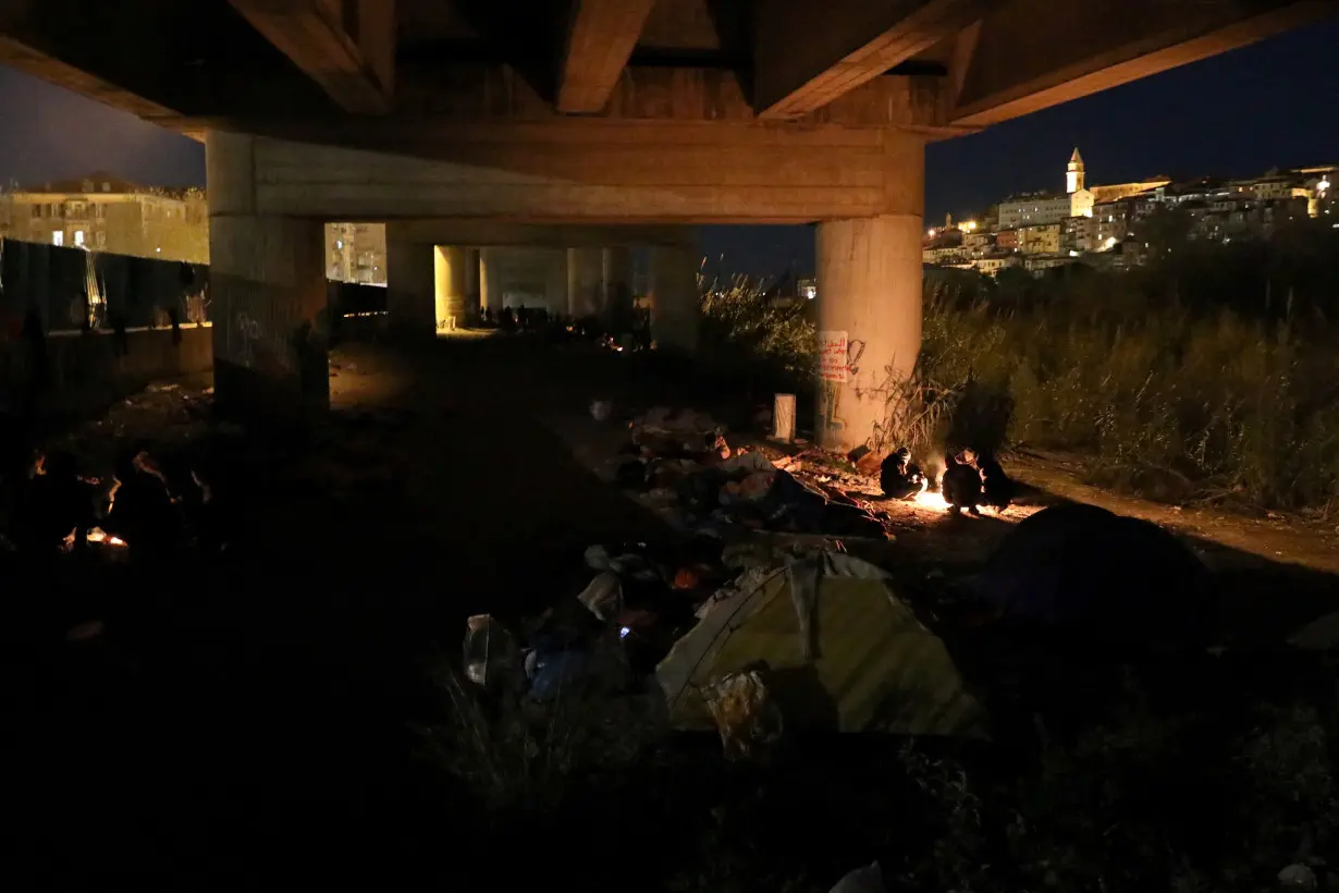 FILE PHOTO: Migrants risk death crossing Alps to reach France