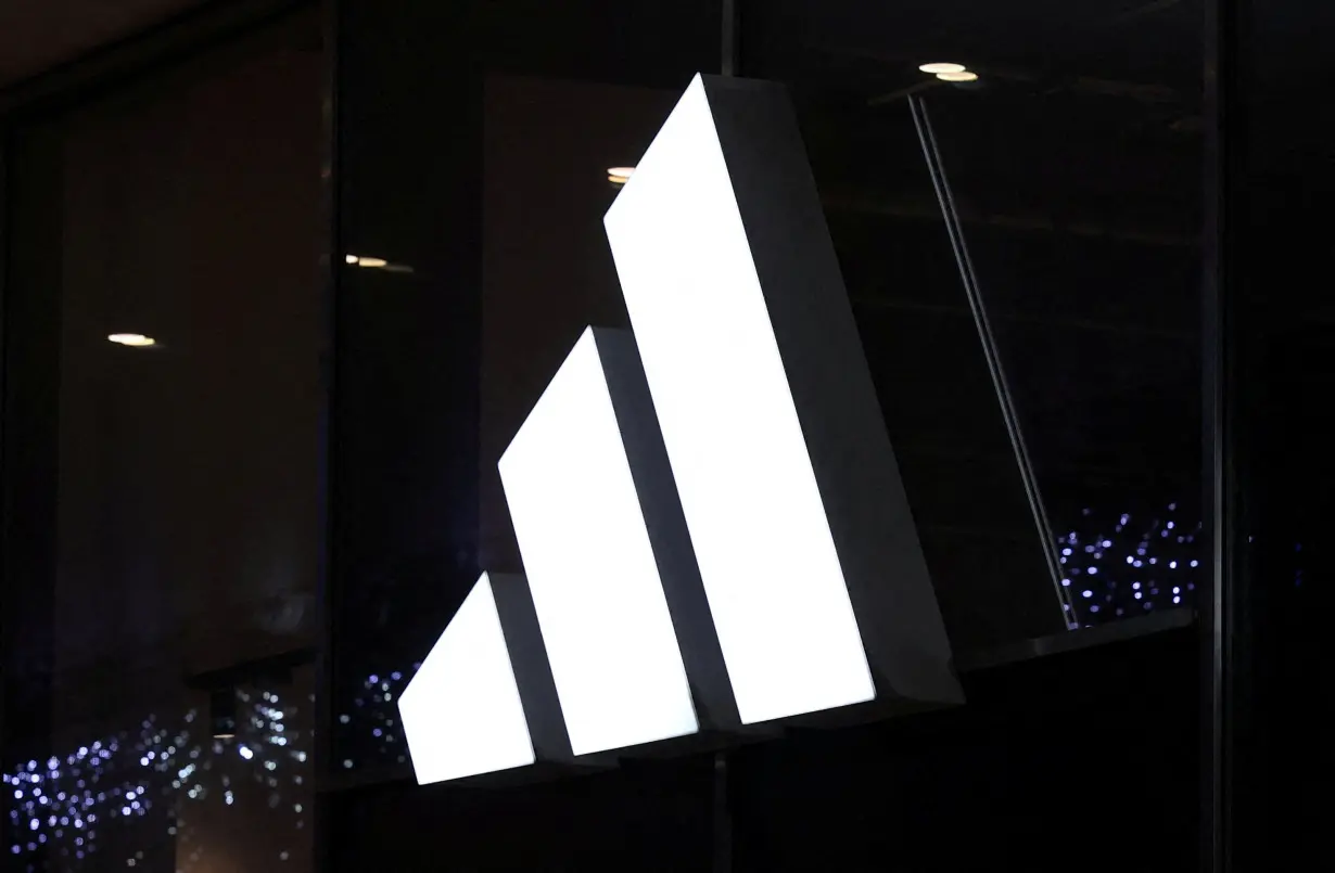 FILE PHOTO: Logo of Adidas brand is displayed on the store in the center of Warsaw