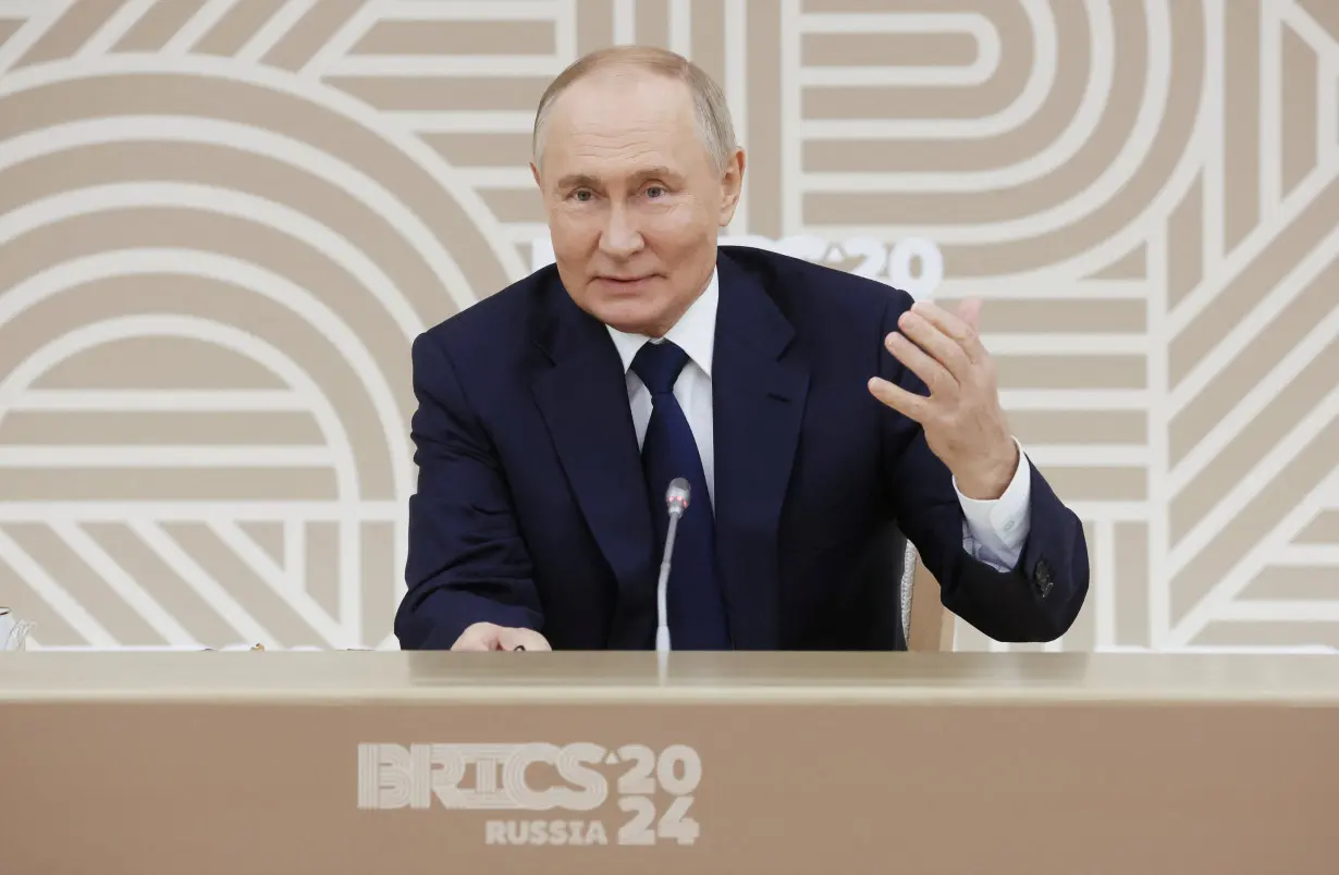 Russian President Vladimir Putin meets with heads of leading media outlets from the BRICS member countries in Moscow