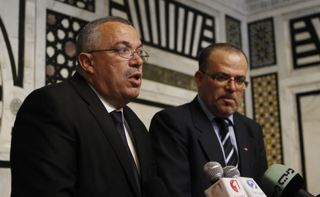 Tunisia's Justice Minister Bhiri and Human Rights Minister Dilou speak at a news conference in Tunis