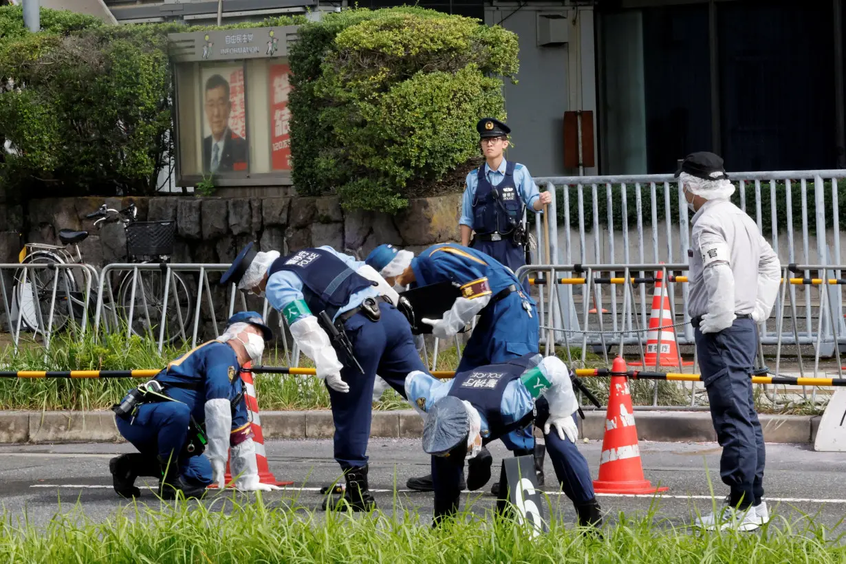 Police investigate an incident at the headquarters of the Liberal Democratic Party, in Tokyo