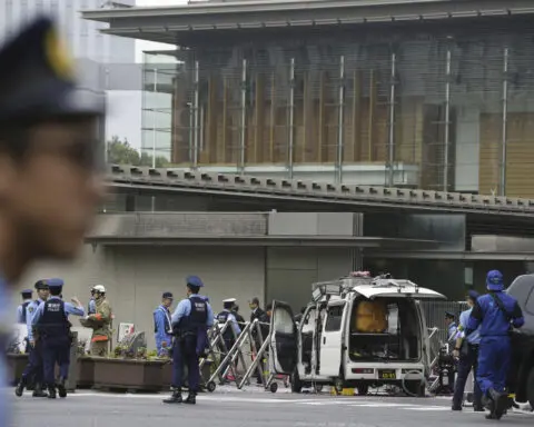 Japan's governing party headquarters is attacked with firebombs and suspect is arrested