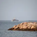 Italian coastguard vessel picks up migrants from Albania to transfer them to Italy