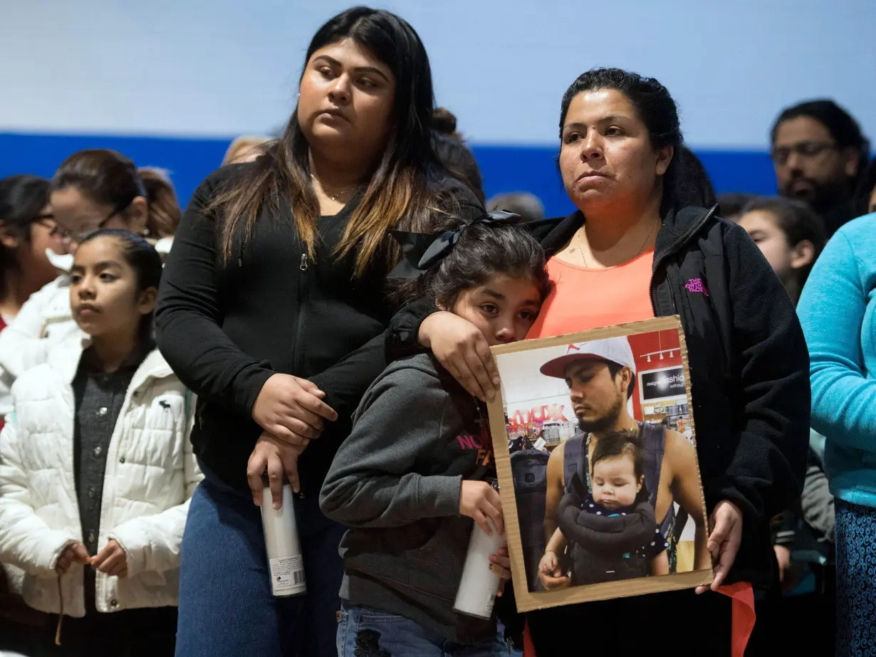 Community members gather at a prayer vigil at an elementary school in Morristown, Tennessee, in April 2018 after ICE raided a meatpacking plant.