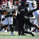 Cam Ward throws for 4 touchdowns, No. 6 Miami survives Louisville comeback bids for wild 52-45 win