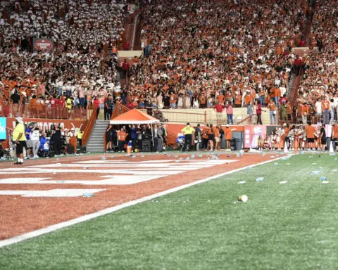 No. 5 Georgia upset No. 1 Texas in game marred by Longhorns fans throwing trash on the field