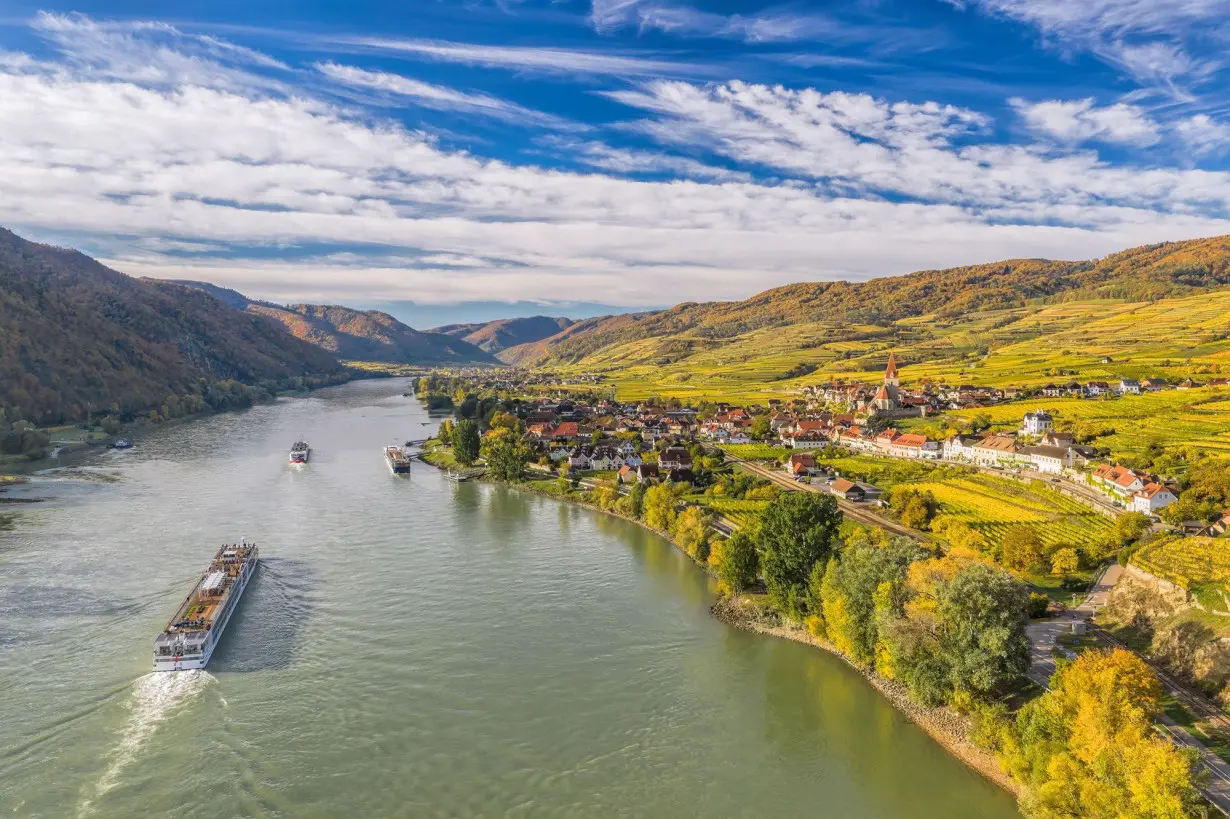 Ships make their way along the Danube River near Weissenkirchen in Austria. European river cruises are a great value right after Thanksgiving into the first two weeks of December, one travel expert says.