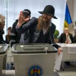 Moldovans cast votes to choose president and decide on EU path as Russian interference claims spike