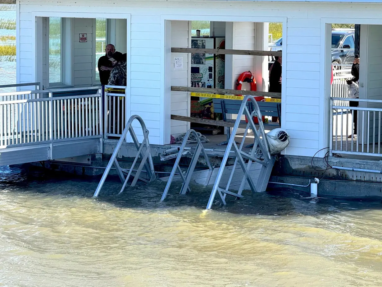 A portion of the gangway that collapsed remains visible on Sapelo Island in McIntosh County, Georgia, on Sunday.