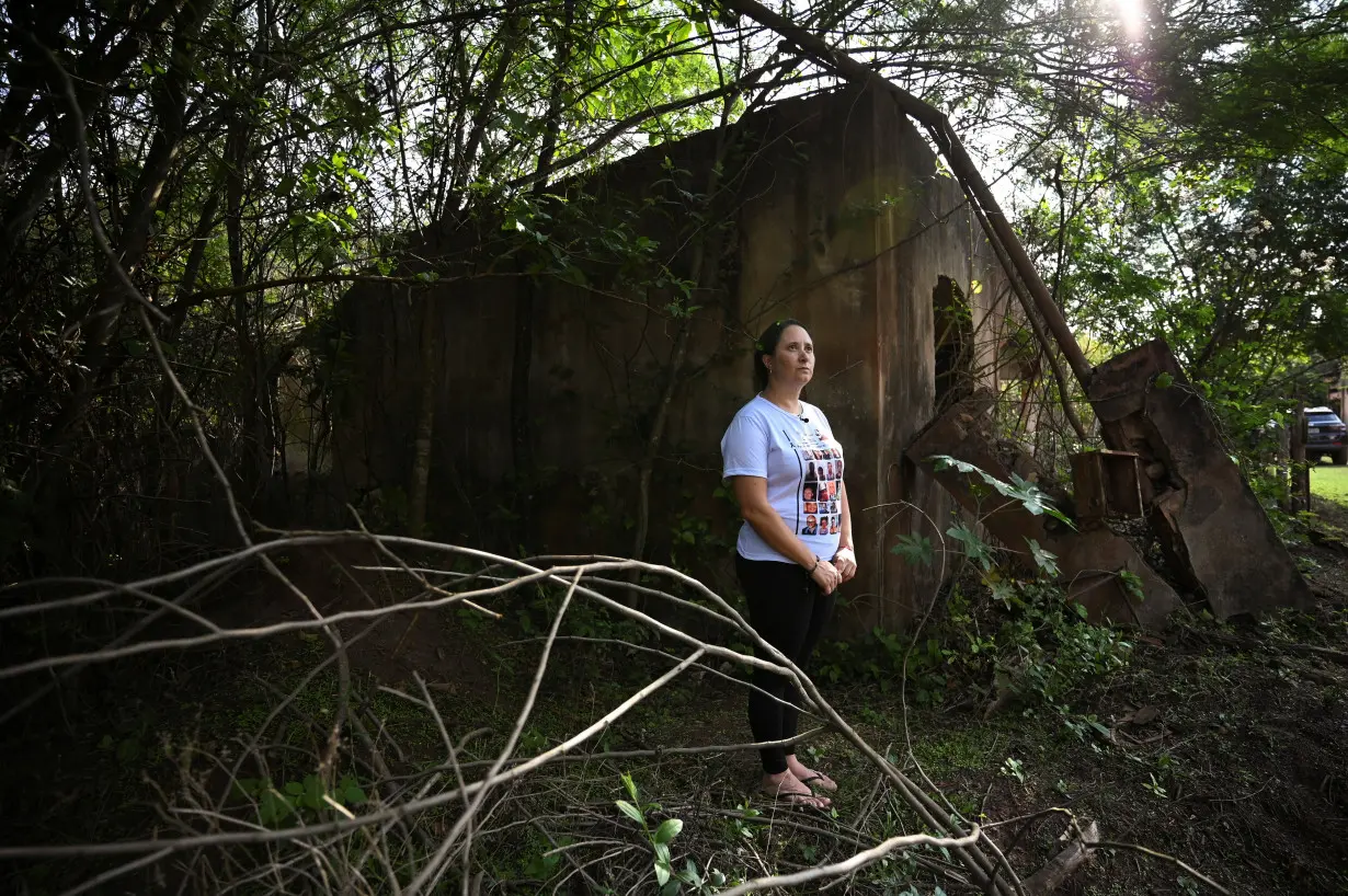 Brazilians affected by the deadly collapse of dam almost a decade ago pose for a picture in Mariana