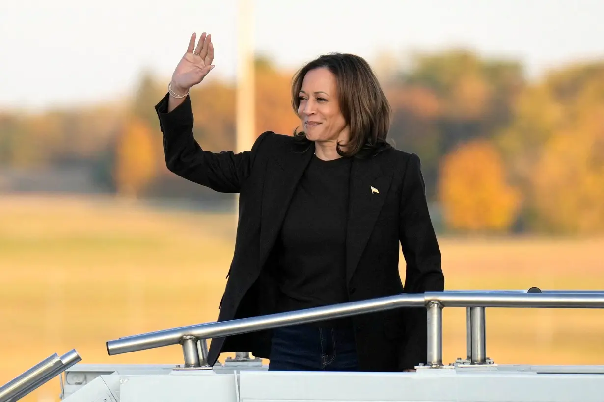 Democratic presidential nominee and U.S. Vice President Kamala Harris boards Air Force Two at Capital Region International Airport in Lansing