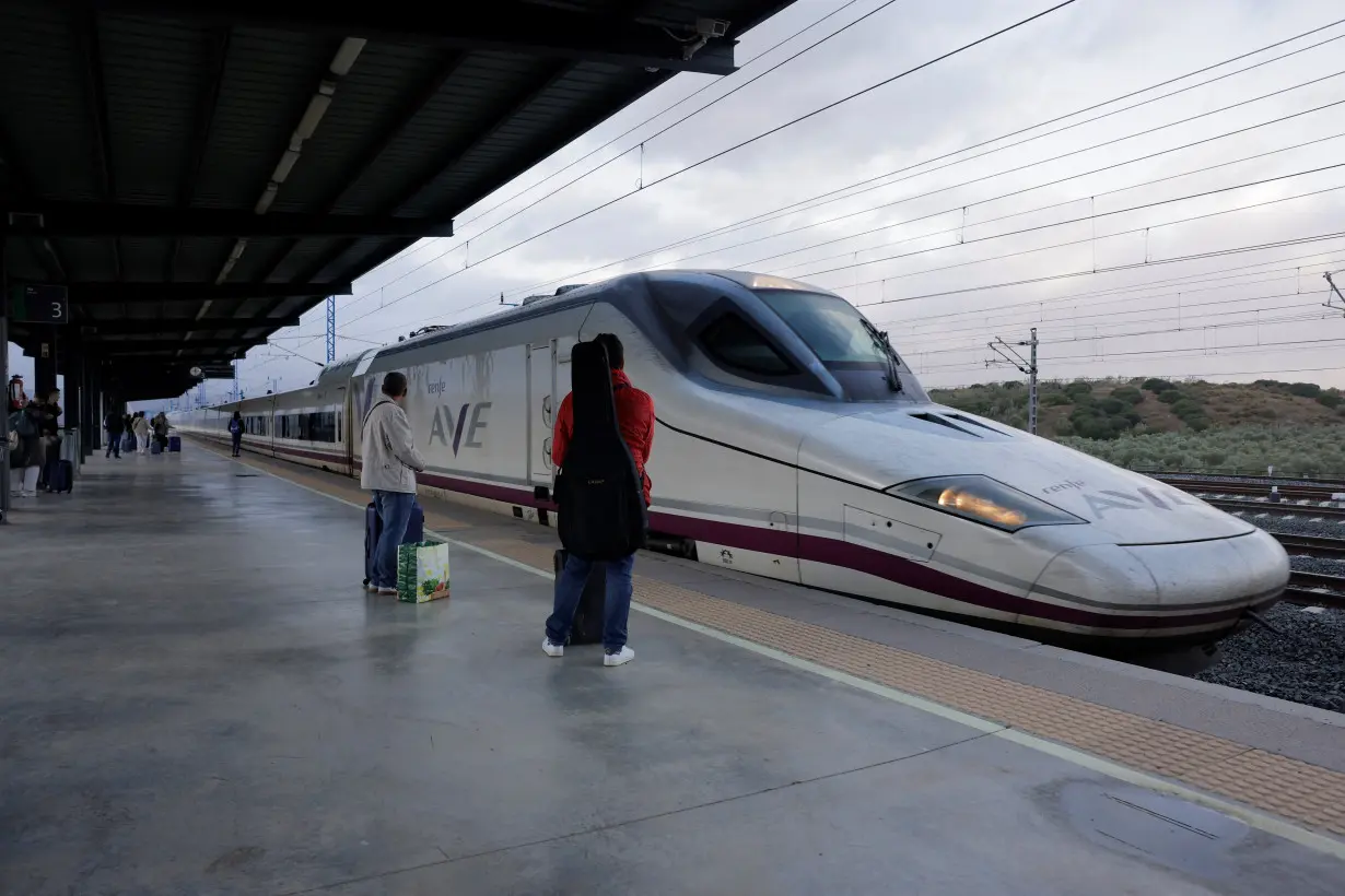 Passengers wait to board an AVE high-speed (Talgo 350) train to Madrid at the Antequera-Santa Ana train station, in Antequera