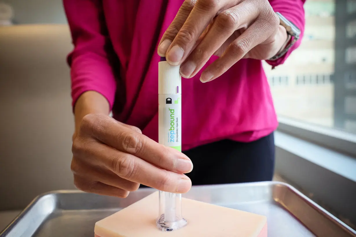 An injection pen of Zepbound, Eli Lilly's weight loss drug, is displayed in New York