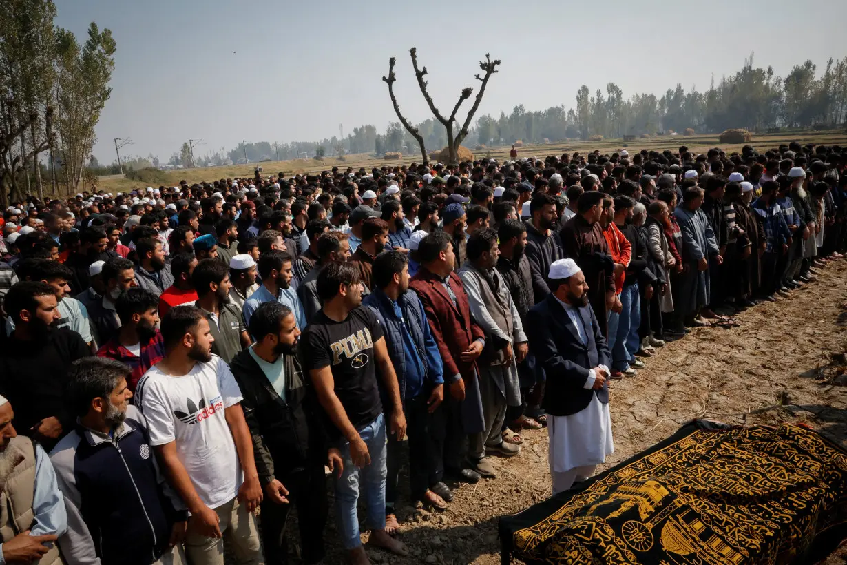 Mourners pray during the funeral of Shahnawaz Dar, a doctor who was killed in a suspected militant attack at a tunnel construction site in Ganderbal's Gaganeer, in Budgam