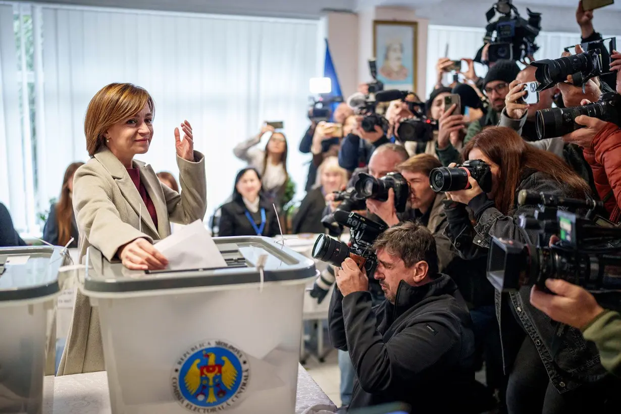 President Maia Sandu casts her vote in Chisinau during Moldova's presidential election and EU referendum on October 20.