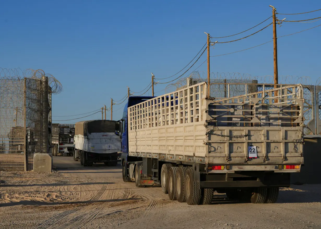 Trucks carrying humanitarian aid make their way to the Gaza Strip at Erez Crossing in southern Israel