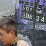 Stock market today: Asian shares fall after Wall Street pulls back from its records