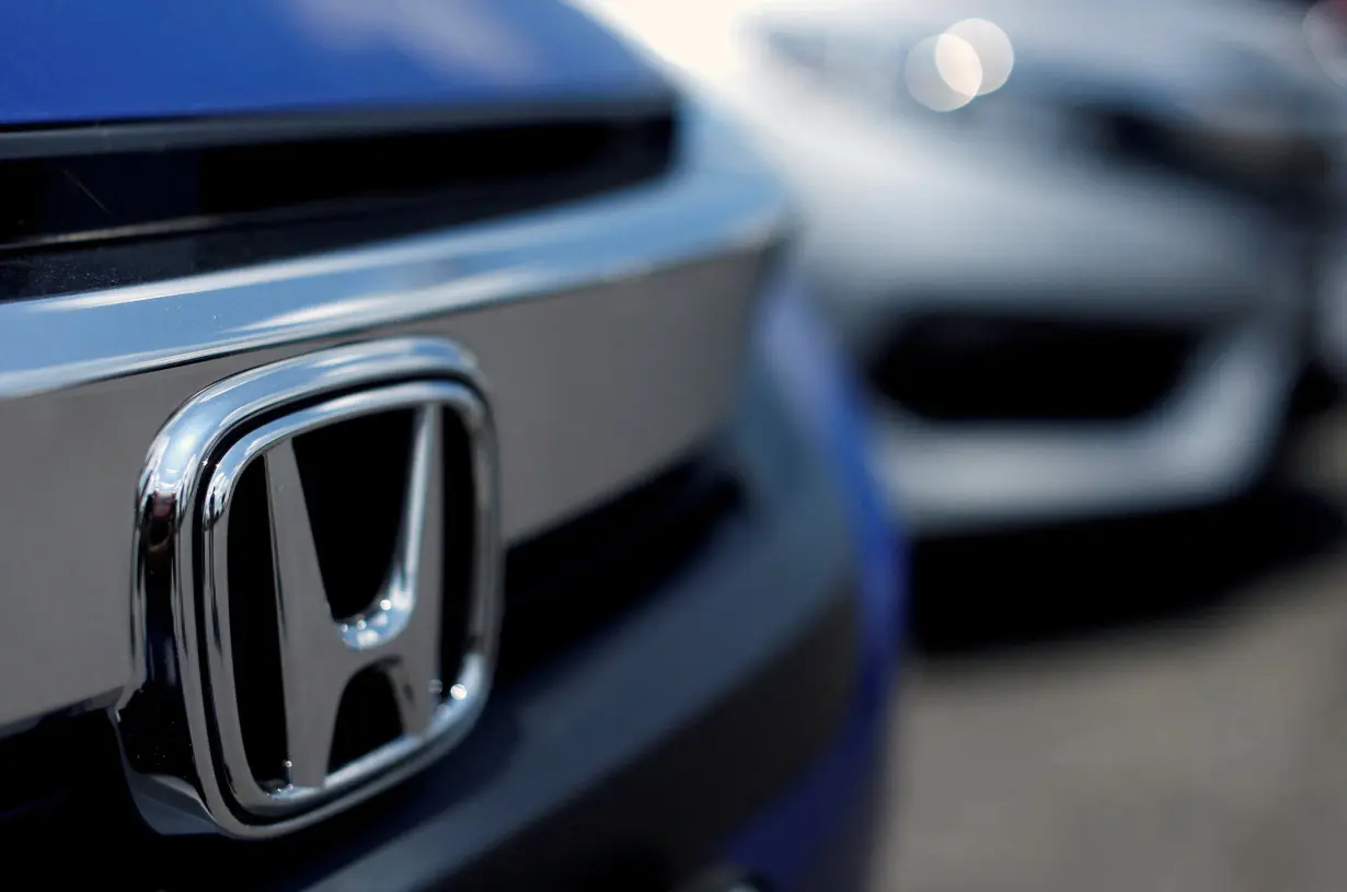 FILE PHOTO: The Honda logo is seen on a new Civic model on a dealer's lot in Silver Spring