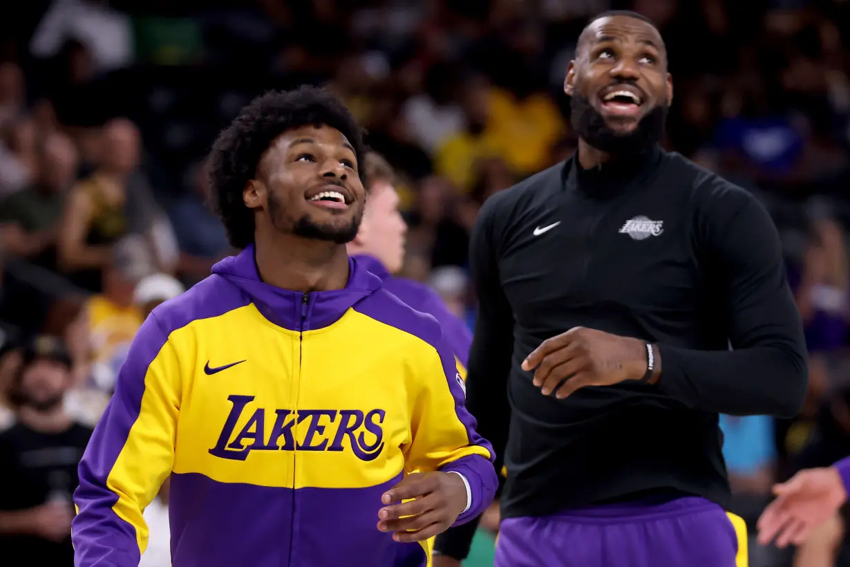 LeBron, Bronny help reveal Lakers' new uniforms.