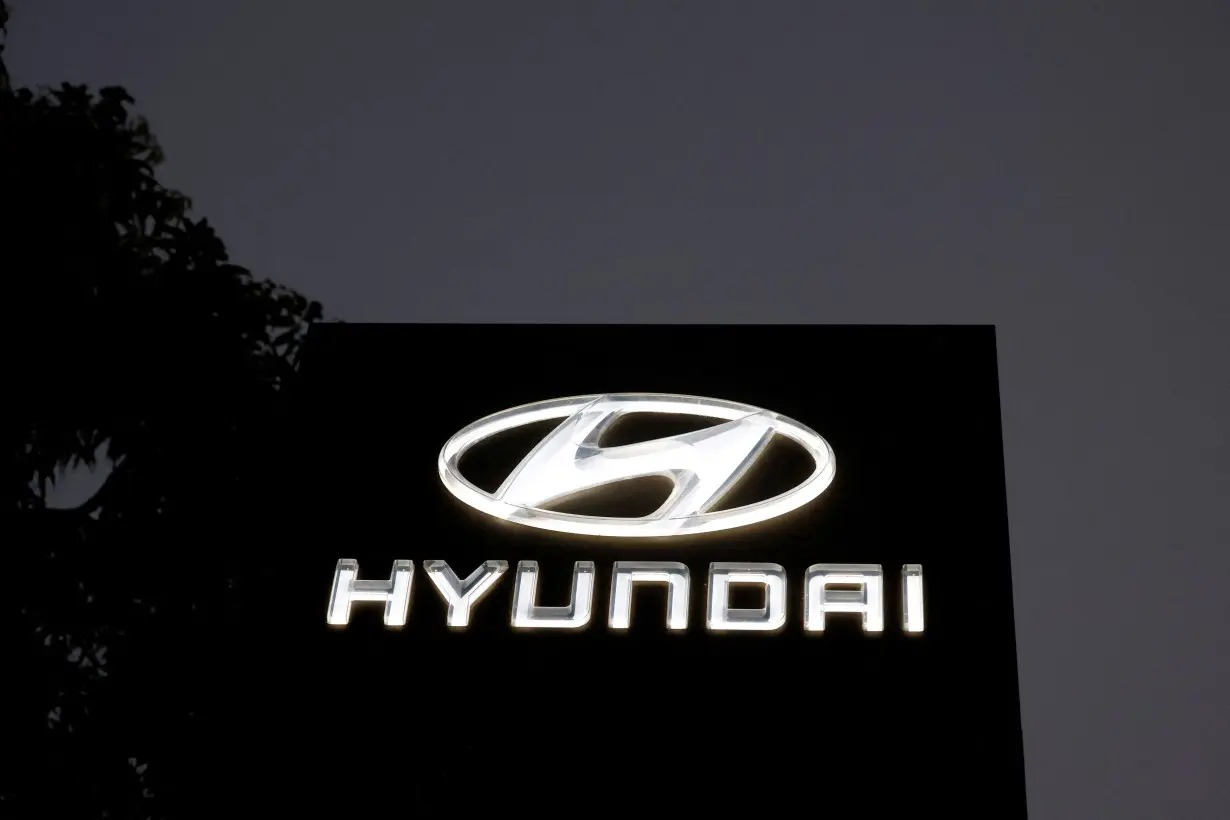 The Logo of Hyundai Motor India Limited is seen outside a car showroom, in Ahmedabad