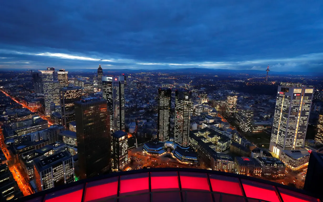 The financial district with the headquarters of Germany's largest business bank, Deutsche Bank (C), is photographed on early evening in Frankfurt