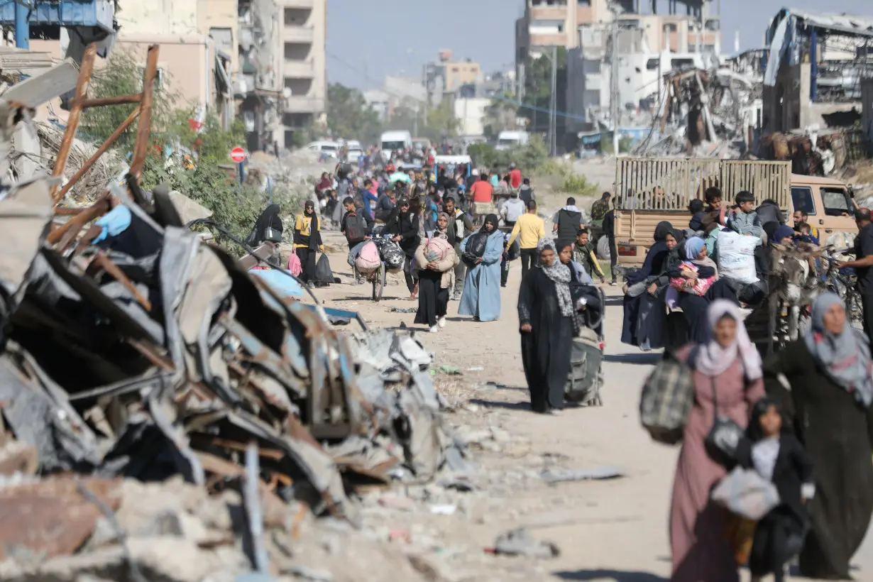 Displaced Palestinians flee the northern part of Gaza amid an Israeli military operation, in Jabalia in the northern Gaza Strip