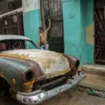 Cuba fights to come back from a nationwide blackout, then a storm that killed six