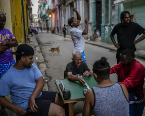 Cuba fights to come back from a nationwide blackout, then a storm that killed six