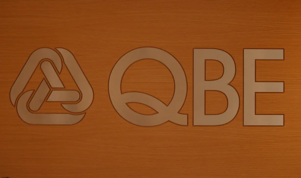 The QBE logo is photographed after the company reported its full-year earnings at its headquarters in Sydney